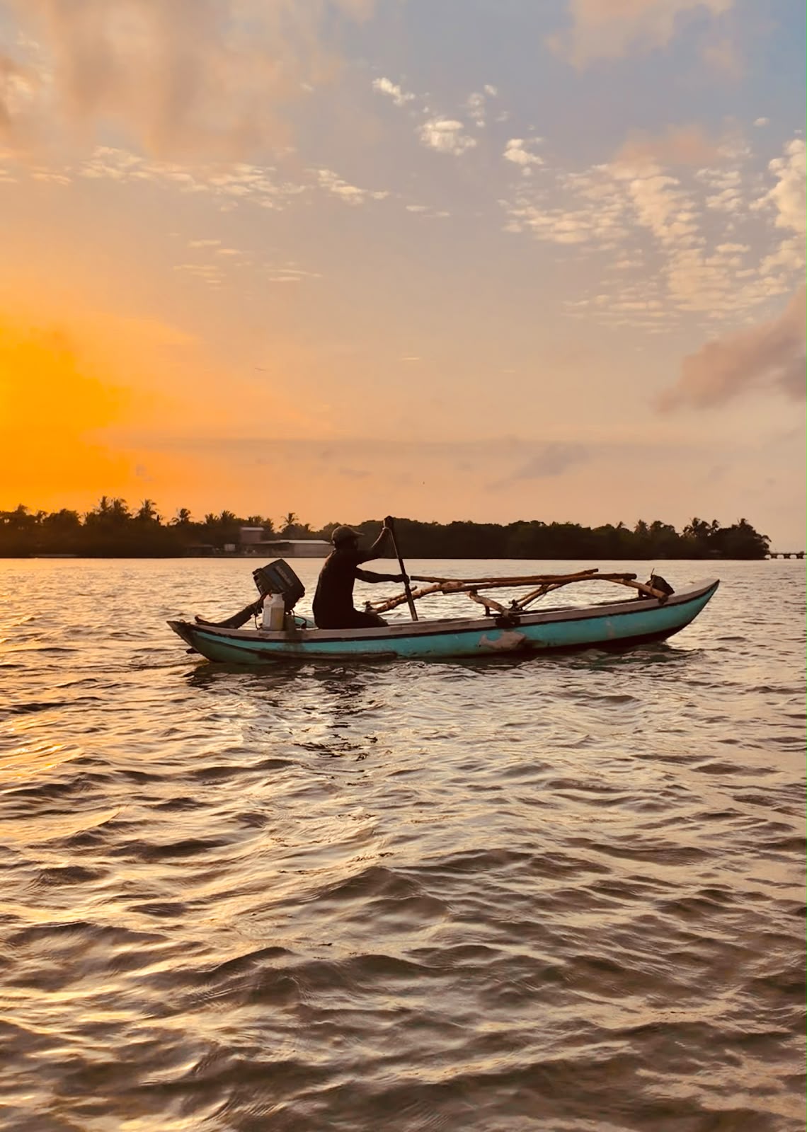 Traditional fishing village on Negombo Lagoon — local fishermen at work Sri Lanka