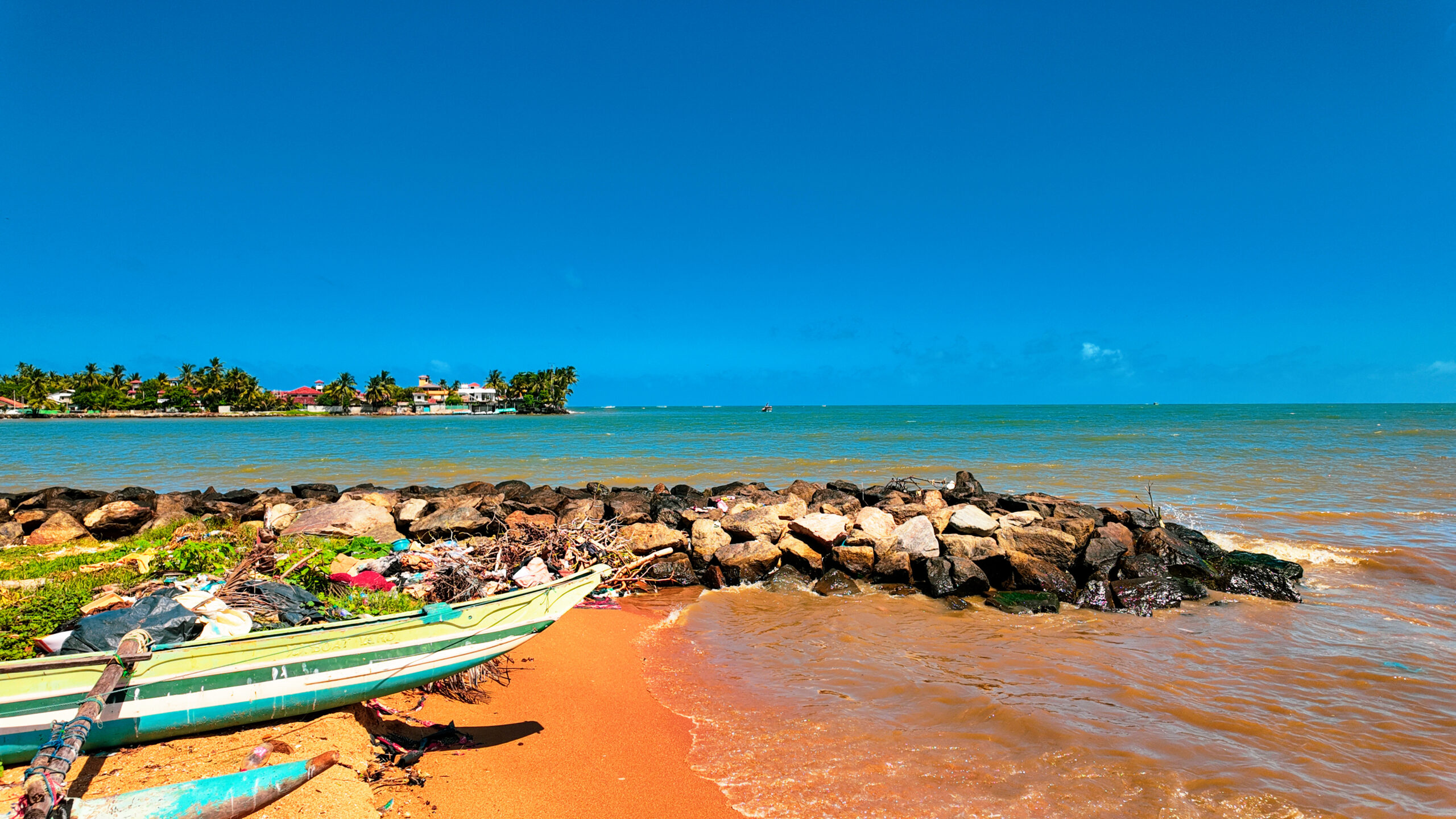 Tourists enjoying a guided boat tour on Negombo Lagoon Sri Lanka with local boat captain